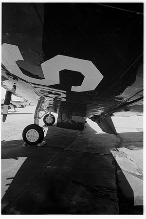 d1071.44 F4U Corsair under port wing, vertical