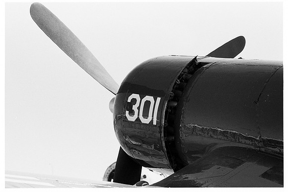 e1072.a14 F4U Corsair nose behind port wing