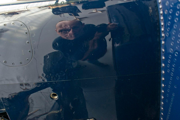 Reflection Of Photographer In TBM Cowling