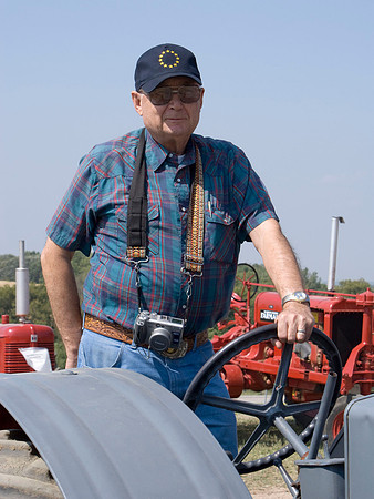 Gene At The Wheel Of A Case Tractor