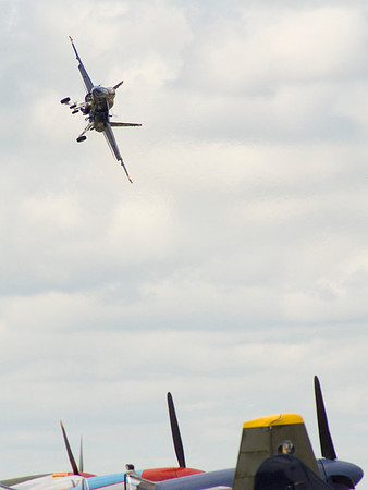 The Hornet Makes A Slow Dirty Turn Over The Flight Line