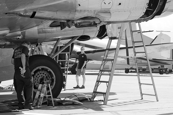 Crew Chief Works On Engine