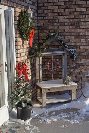 Late Christmas Ornaments On Porch