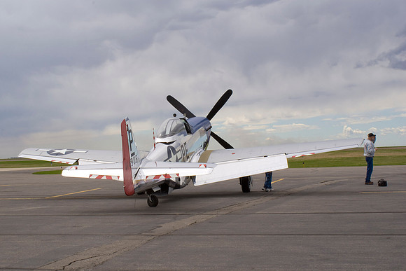 Mustang Reflects Breaking Clouds